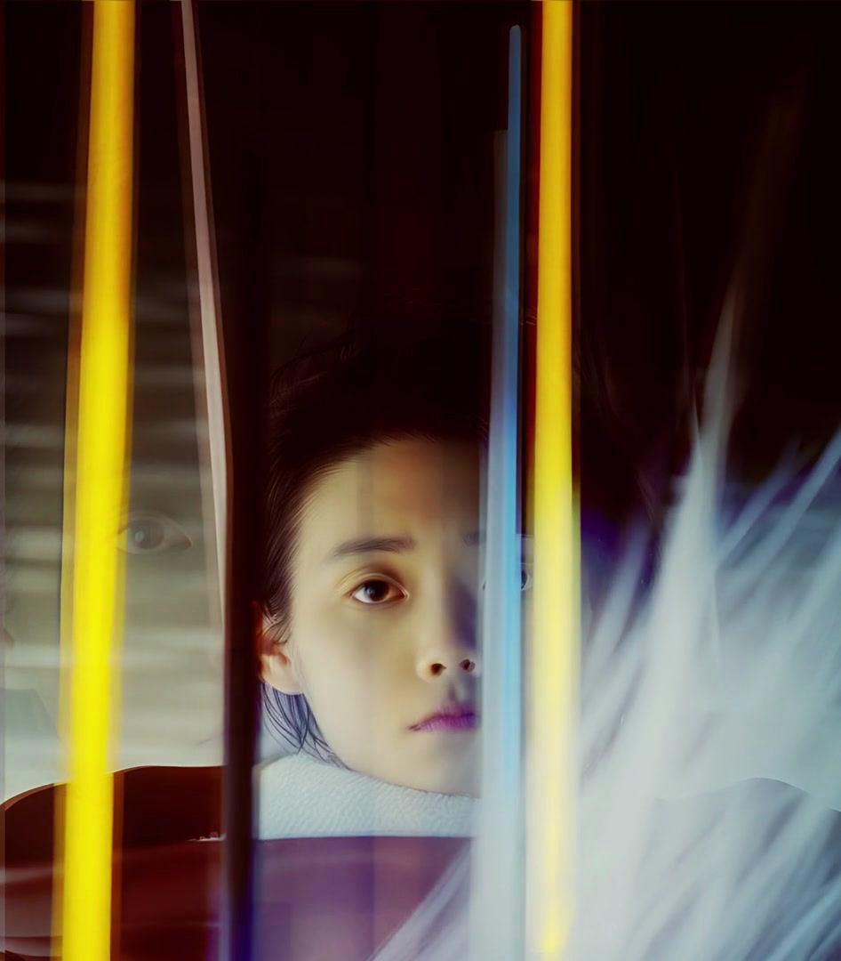 Layered face framed by vertical yellow light bars and a pale blue blur